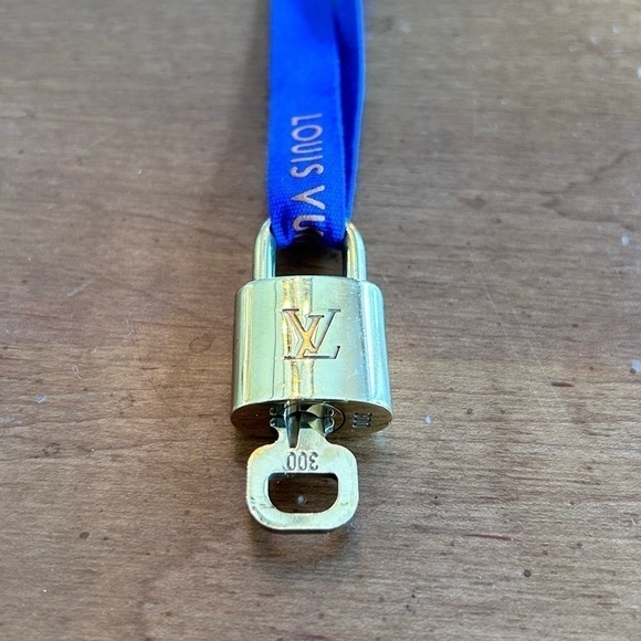 Louis Vuitton Lock & Key Strung On a LV Blue & Orange Ribbon. - Picture 1 of 11